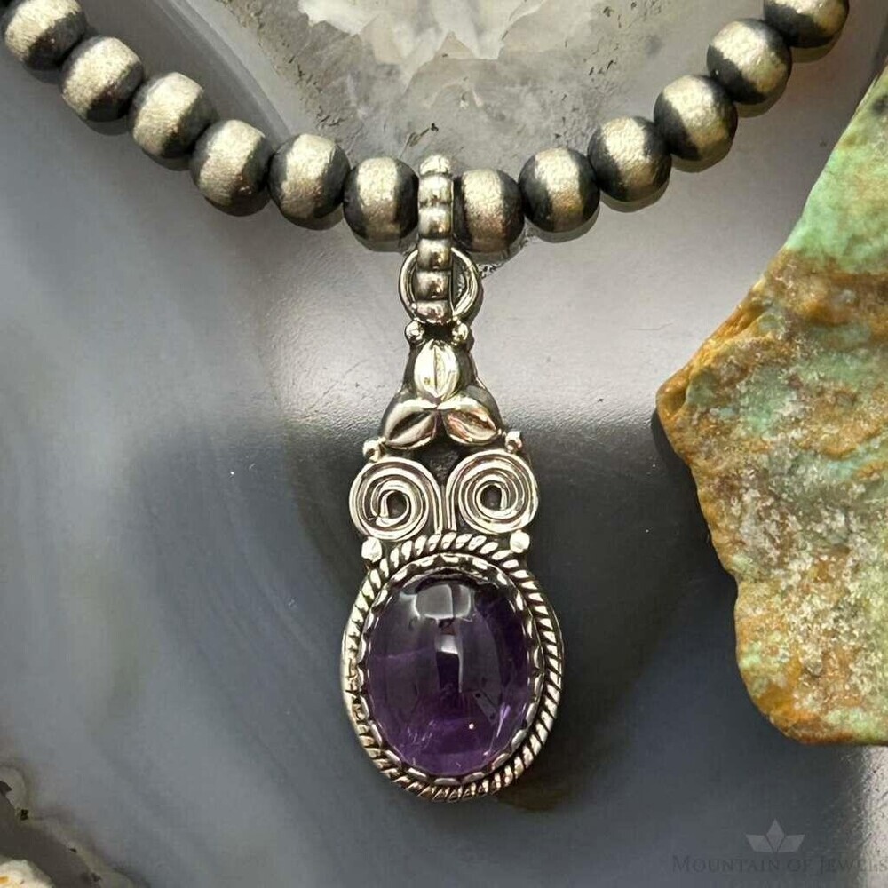 Sterling Southwestern Style Oval Amethyst Decorated Charm/Pendant For Women